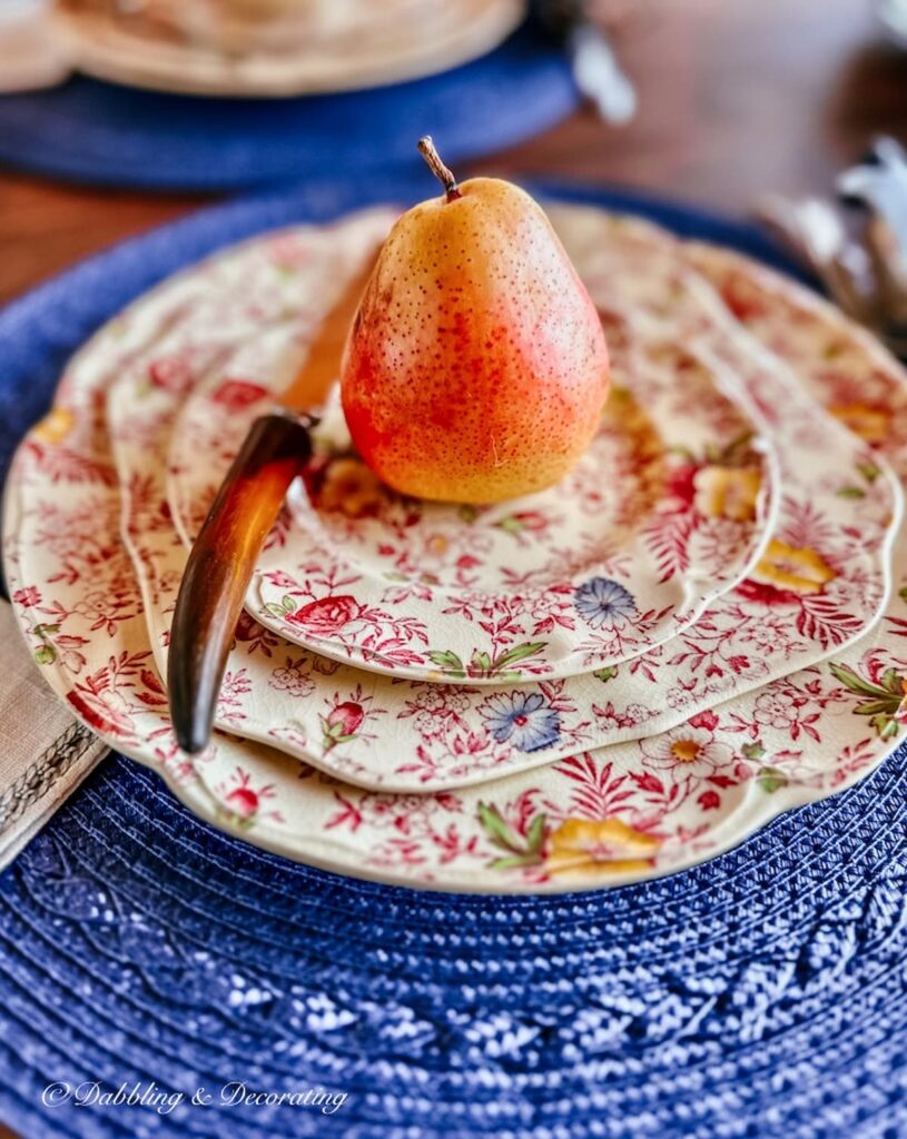 Johnson Brother's vintage Chintz place setting with pear fall tablescape on blue placemat.