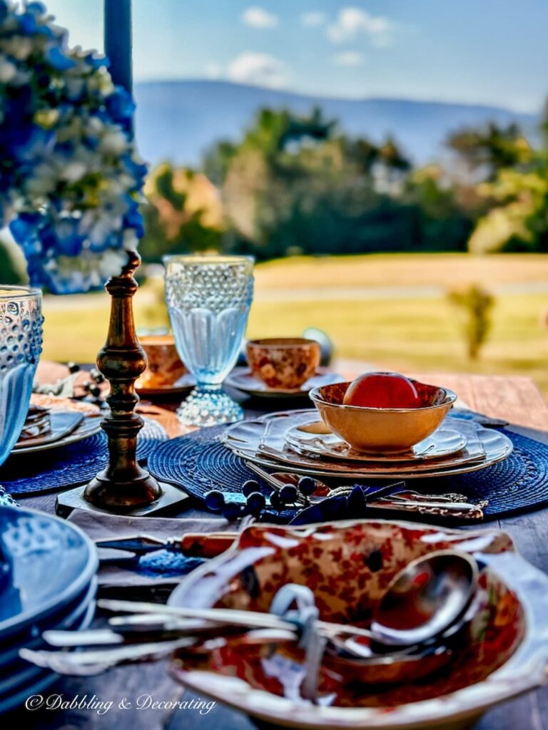 Fall tablescape with mountain views with blue accents on front porch.