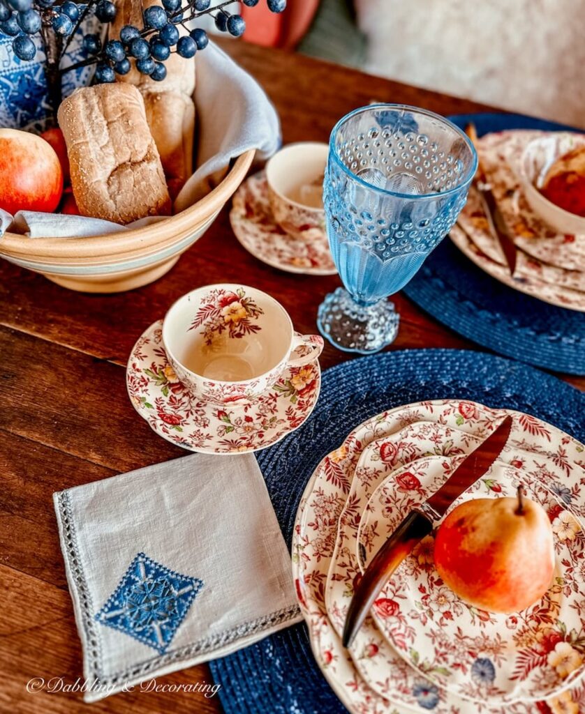 Fall tablescape with vintage Johnson Brothers Chintz dinnerware and blue and white details.