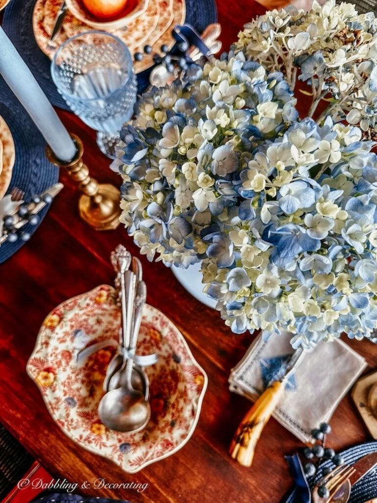 Vintage Johnson Brothers Chintz fall tablescape with blue hydrangeas.