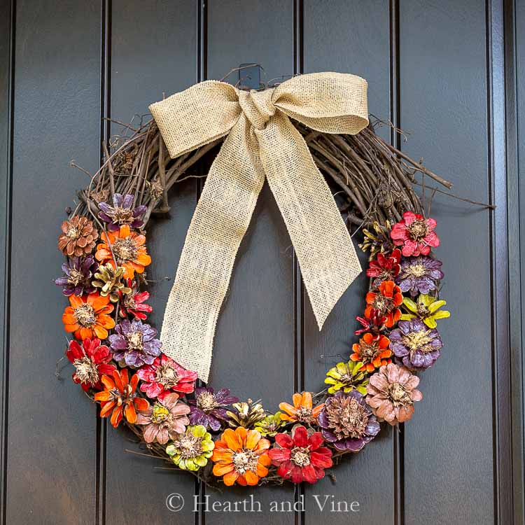 Colorful Fall Pinecone Wreath on Black Door.