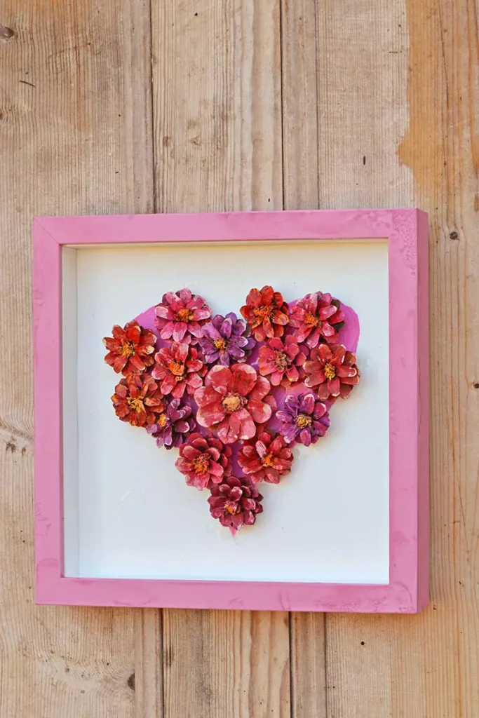 Pink heart pinecone framed Craft picture.