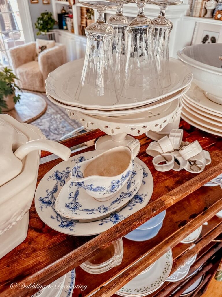 Vintage white collections on a cobbler rack.