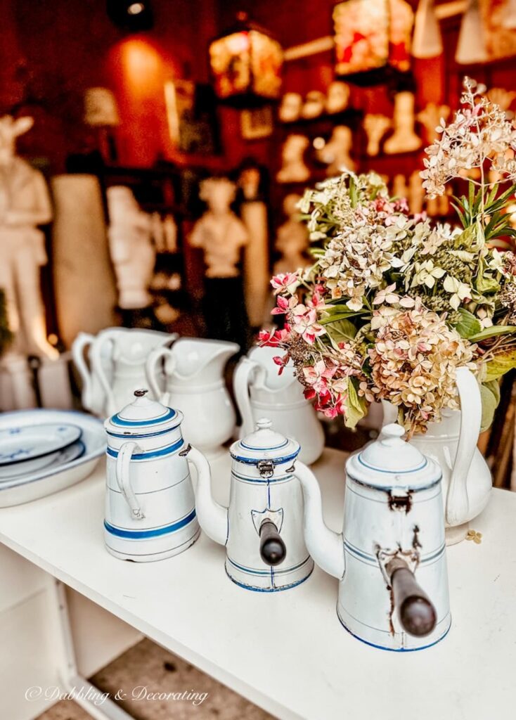 White tea pots at a French flea market.