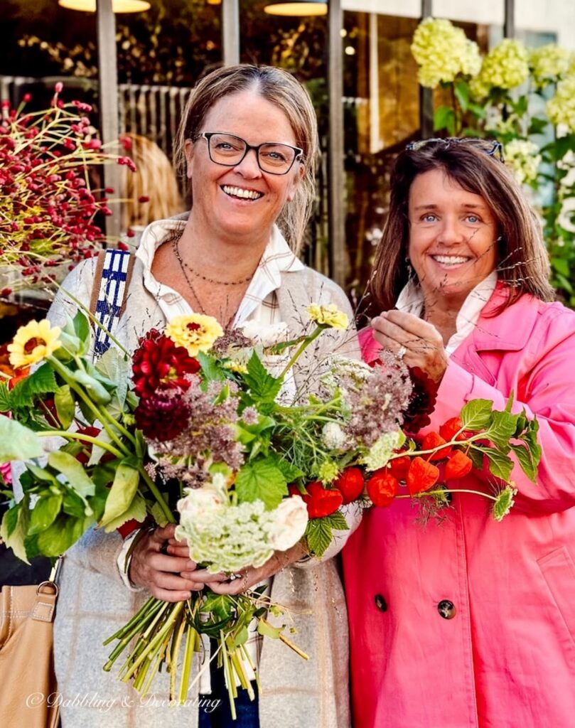 Two women in Paris with French bouquet of Flowers.