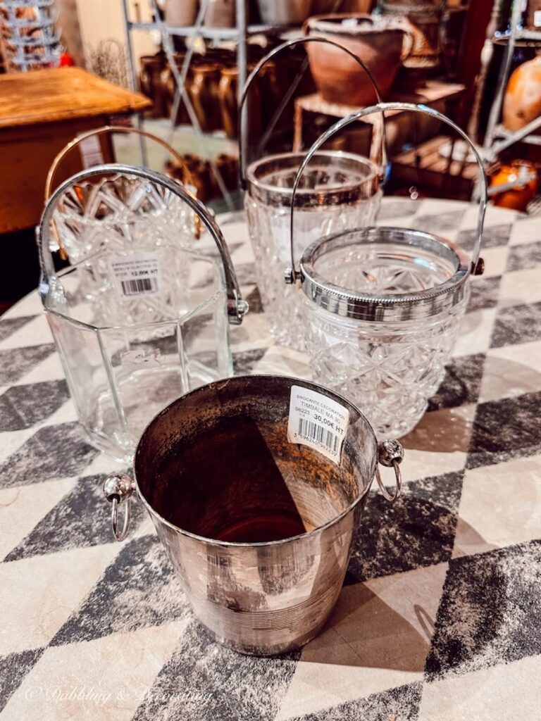 Small crystal antique ice buckets at antique store in Paris.