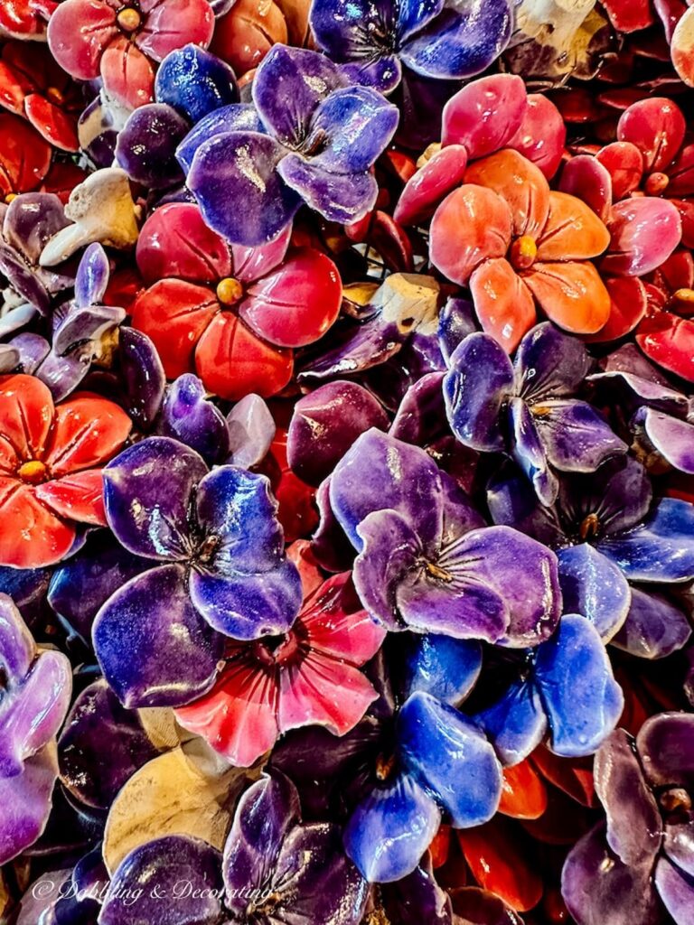 Colorful Burial ceramic flowers for cemetery at antique store in Paris.