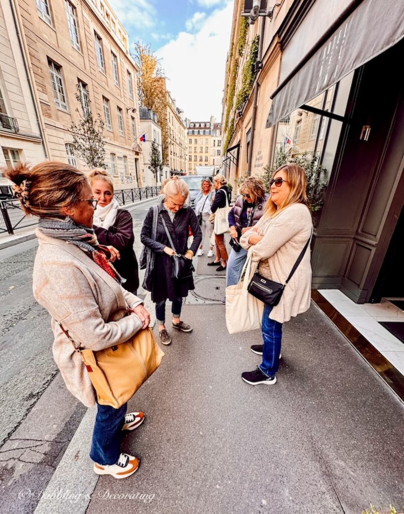 Gathering of women in Paris getting ready to attend a Paris street fair.