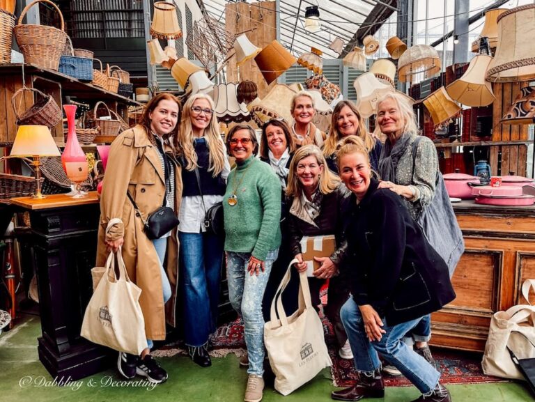 Group of women shopping in private antique warehouse in Paris.