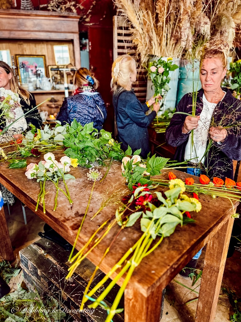 Table full of flowers at a flower bouquet workshop in Paris.