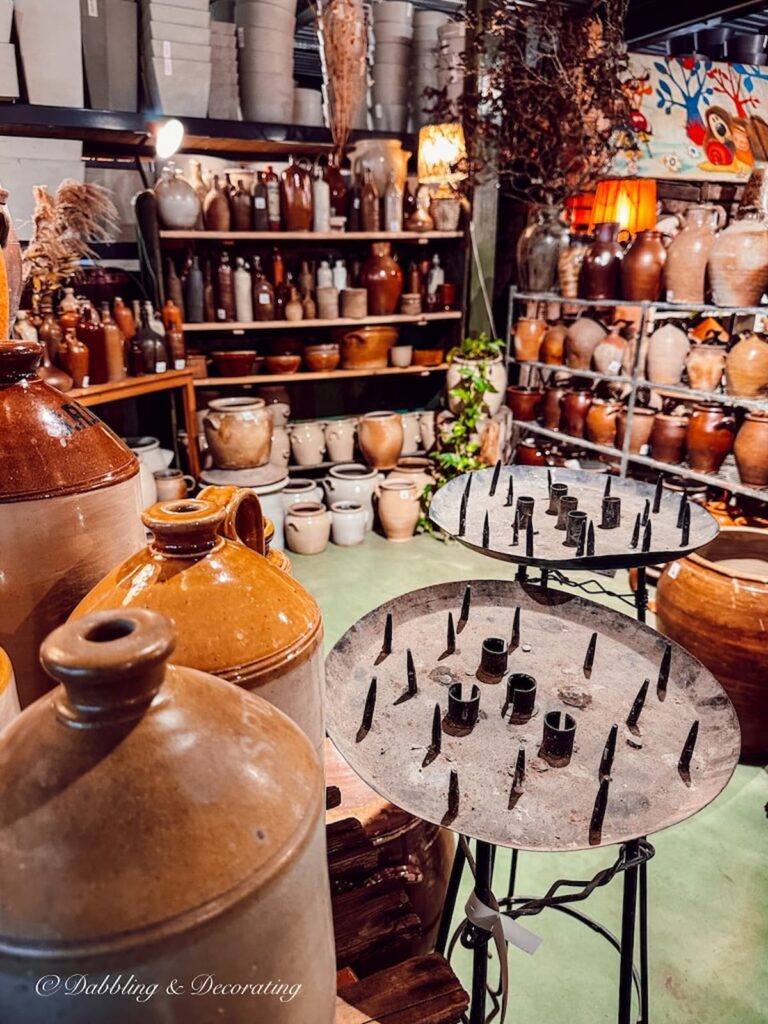 Antique crocks displayed in private vintage warehouse in Paris.