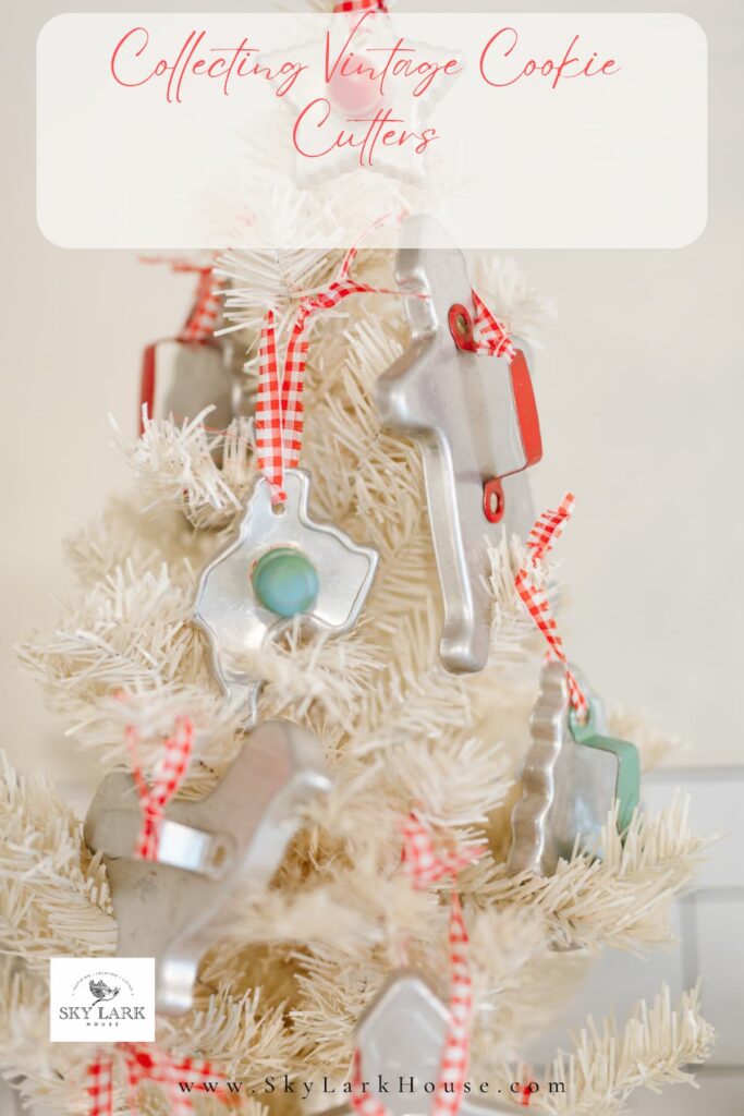 White Vintage Christmas tree with vintage cookie cutter ornaments.