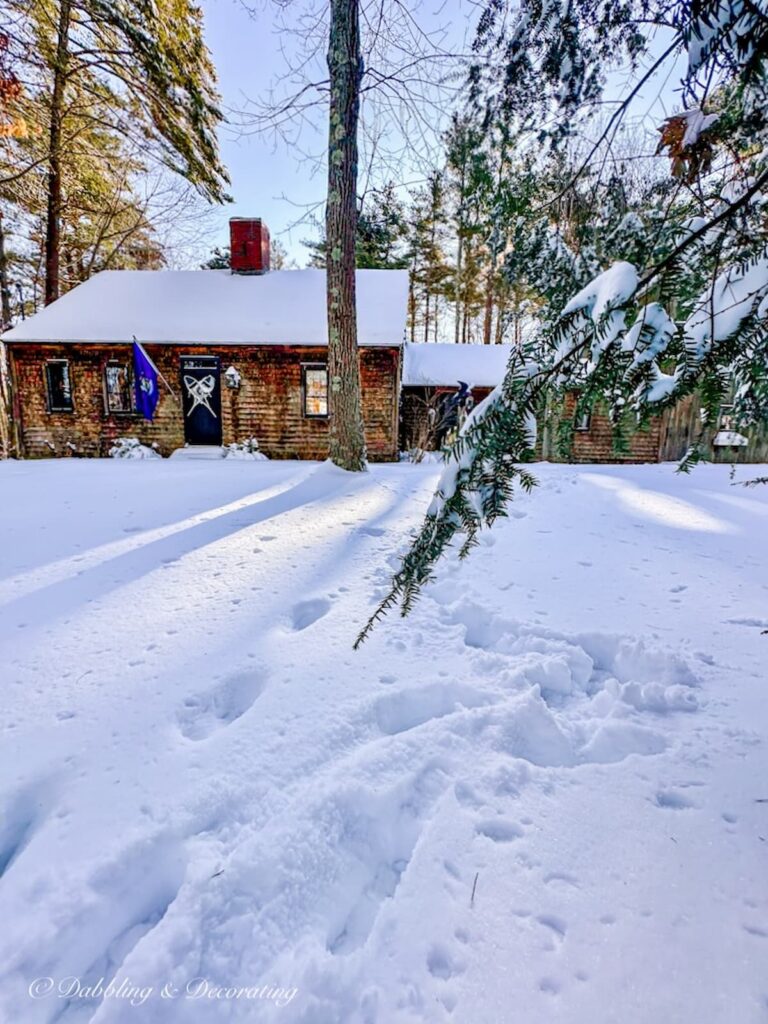 Cedar shake house in winter's snow in coastal Maine.