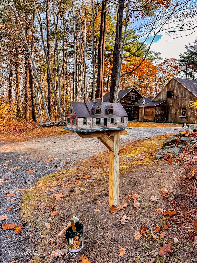 Unpainted mailbox post with unique mailbox on it with paint can of Essex Green paint ready to paint.