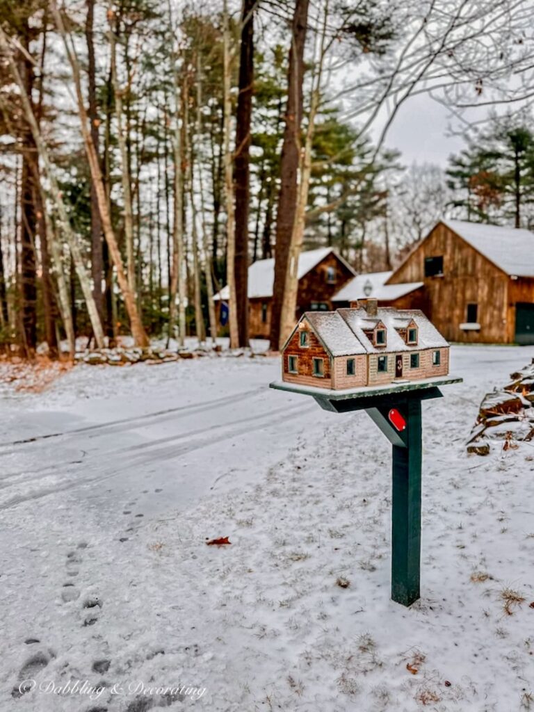 Unique mailbox house with cedar shakes in front of home with cedar shakes siding with curb appeal.