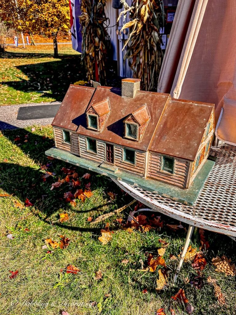 Cedar shake and copper roof unique mailbox house at antique store.