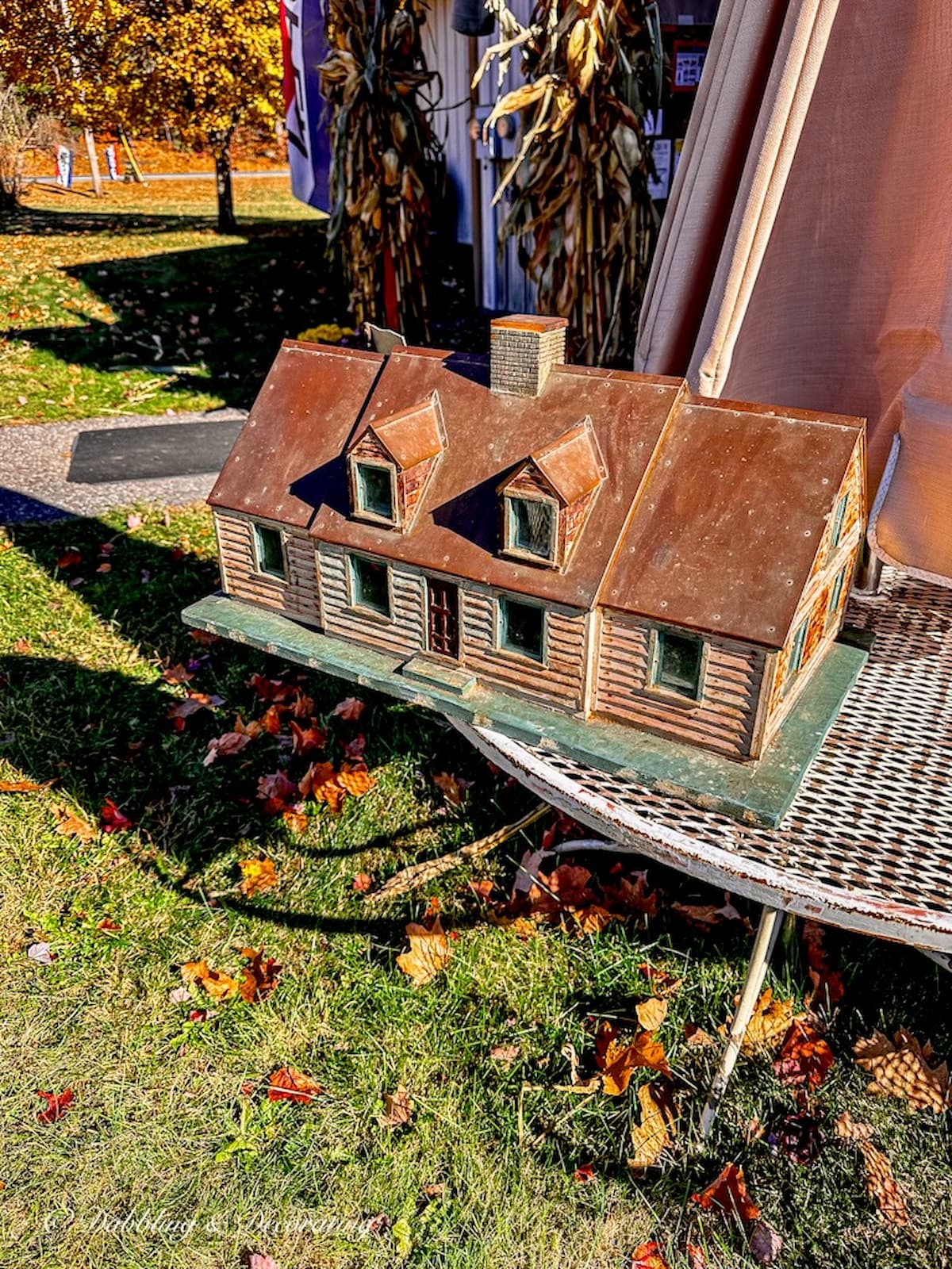 Cedar shake and copper roof unique mailbox house at antique store.