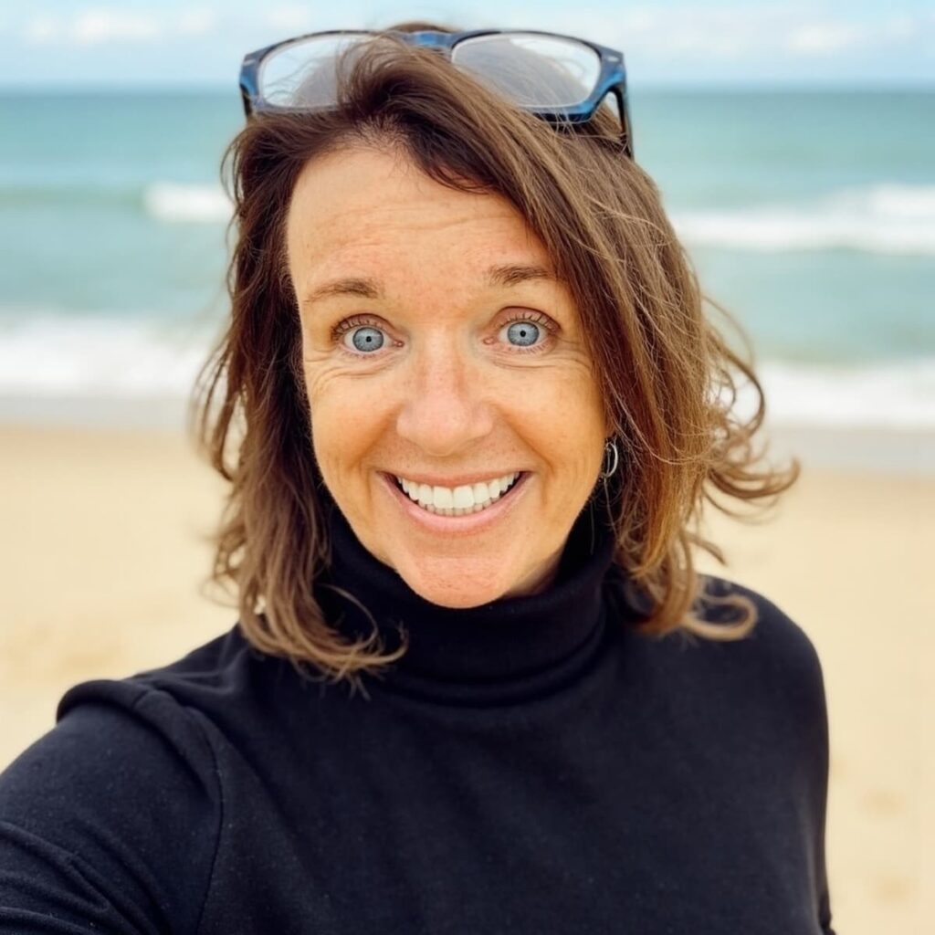 Ann in black turtleneck at Beach.