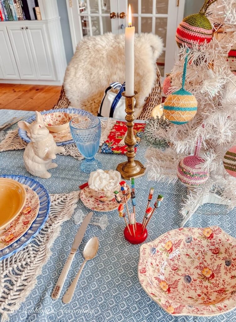 Simple winter table decorations on blue Mountain Weaver tablecloth with vintage details.