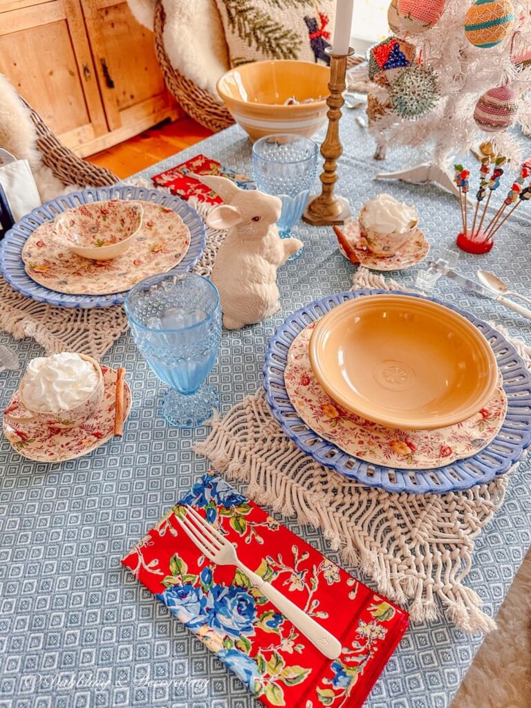 Yellow and blue simple winter table decorations with vintage place settings.