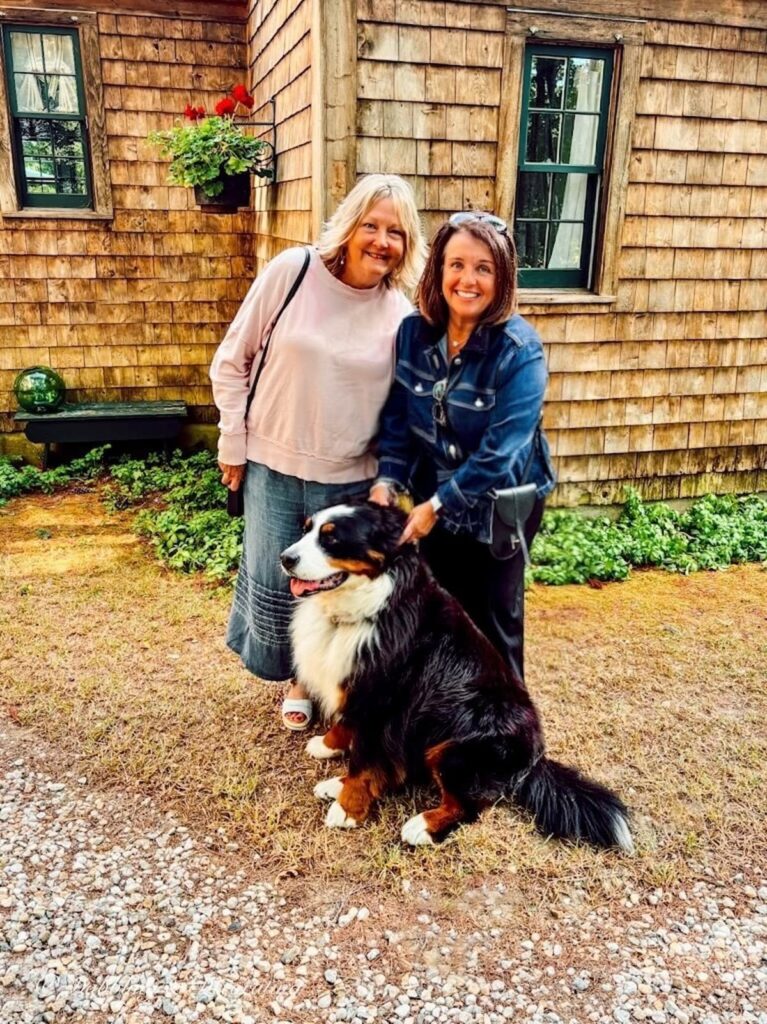 Rachel, Ann, And Ella our Bernese Mountain Dog in front of Cedar Shakes home in Maine.