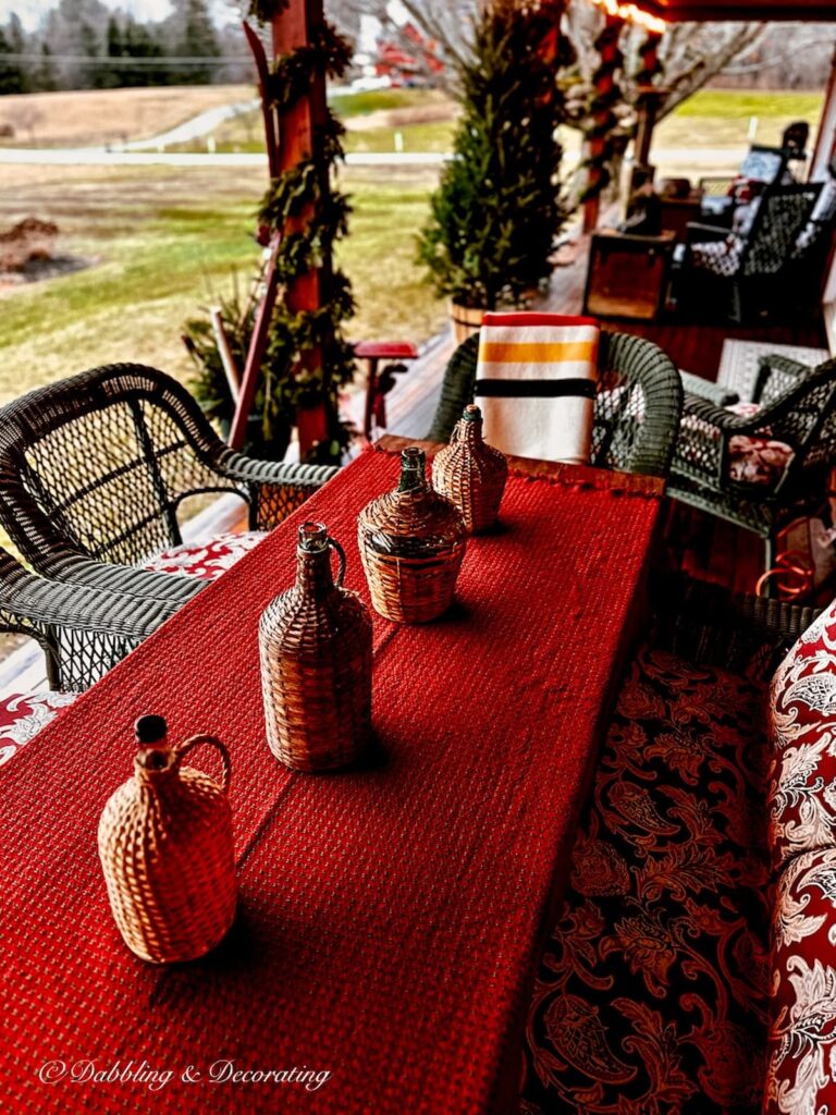 Red Mountain Weaver table cloth on outdoor porch table for Christmas for Simple winter table decorations