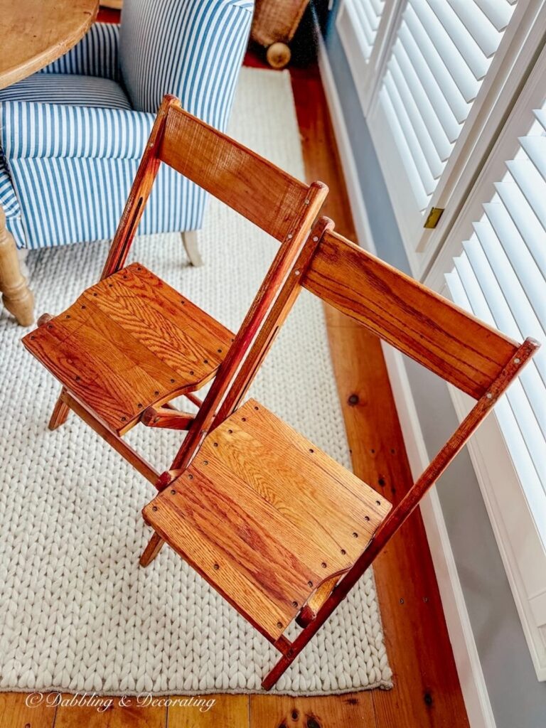 Two vintage folding oak chairs from The Hower House Museum in Akron, Ohio.