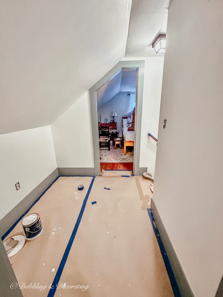 Small hallway between two attic bedrooms painted in simply white. Work in progress.