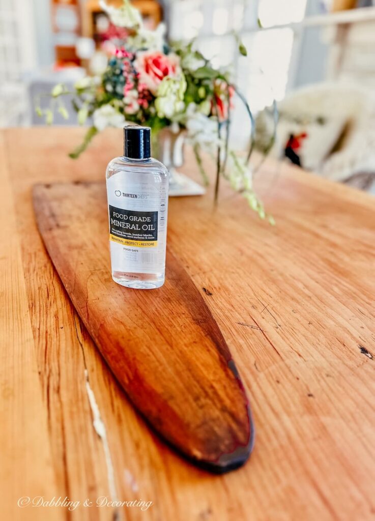 Mineral Oil on antique trapper's fur stretcher on wood table. to create an Eclectic Interiors charcuterie board.