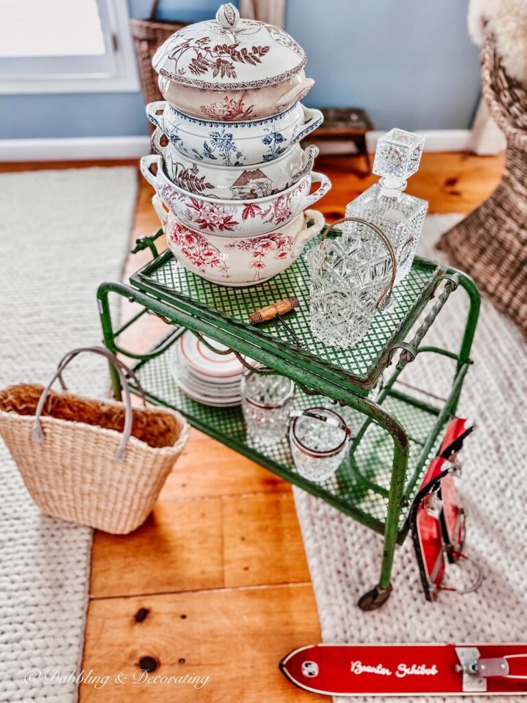 Antique bar cart in green with other antique finds.