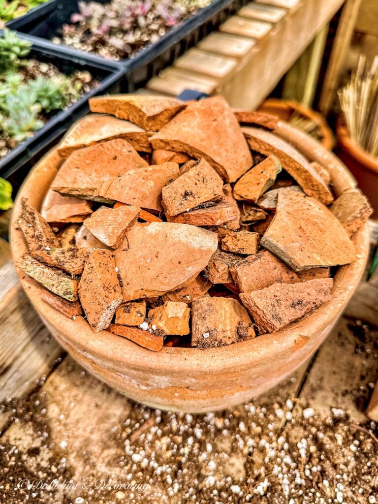 Terracotta bowl of broken up terracotta chips.